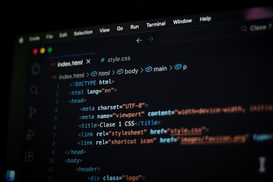 A close-up shot of a computer screen displaying colorful lines of code, including HTML and JavaScript snippets, with a focus on the syntax highlighting. The background is blurred, emphasizing the text